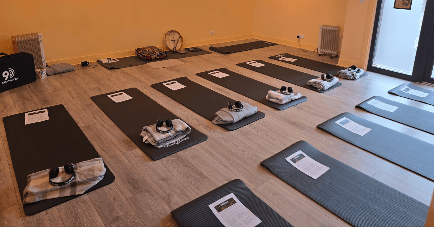 A Ctrl Alt Breathe group session set up with mats, blankets and headphones